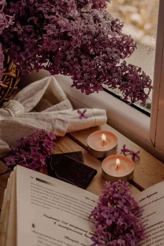 book with flowers and scented candles